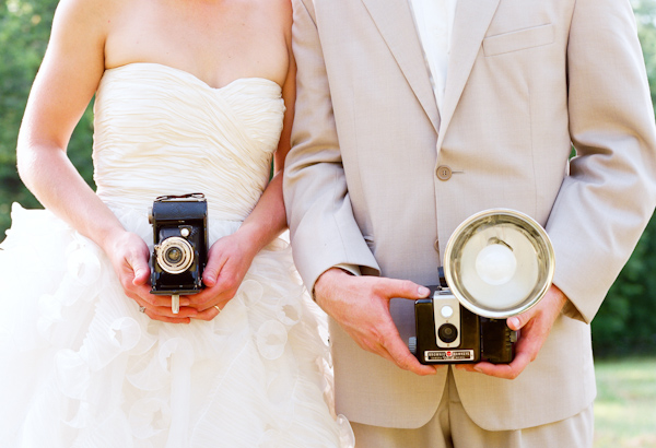 bride and groom with cameras wedding photo by Elizabeth Messina Photography